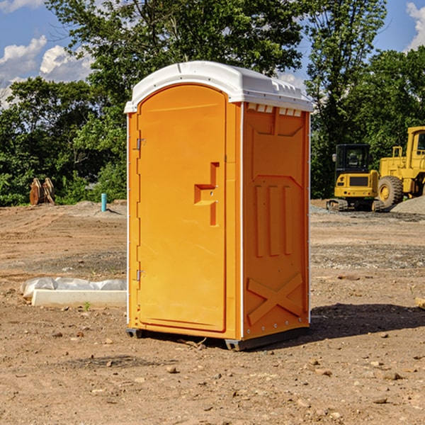 what is the cost difference between standard and deluxe portable toilet rentals in Mack